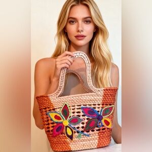 EUC woven straw tote bag with colorful butterfly and floral embroidery.